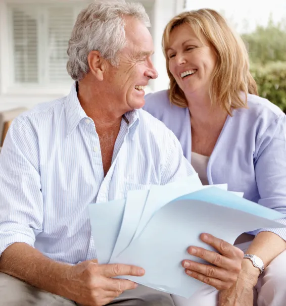 Senior couple smiling looking at each other